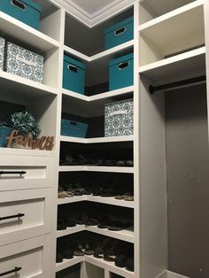 an organized closet with blue baskets and drawers