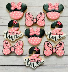 minnie mouse cookies decorated with pink and black fondant for two year old birthdays