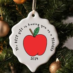 an ornament hanging from a christmas tree that says, first class having years is today