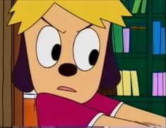 a cartoon character with headphones on sitting in front of bookshelves