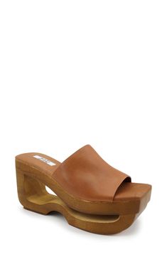 A woodgrain platform with a cutout detail puts an eye-catching spin on this outfit-elevating sandal. 3 1/4" heel; 2" platform Cushioned footbed Leather upper, lining and sole Imported Brown Open Toe Platform Slippers With Removable Insole, Modern Clogs With Wooden Open Heel, Spring Leather Platform Slippers With Wooden Heel, Modern Open Heel Clogs With Wooden Heel, Spring Clogs With Sculpted Open Heel, Chic Brown Open Toe Platform Slippers, Modern Brown Heels With Wooden Heel, Open Toe Wooden Clogs With Removable Insole, Trendy Clogs With Removable Insole And Open Heel