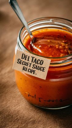 there is a small jar of food with a label on it that says del taco secret sauce recipe