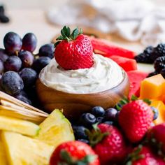 an assortment of fruit including strawberries, bananas, pineapples and blueberries