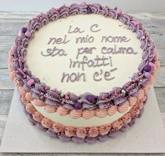 a cake with writing on it sitting on top of a table