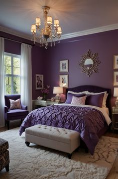 a bedroom decorated in purple and white with a chandelier hanging from the ceiling