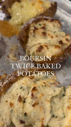 two baked potatoes sitting on top of a baking pan with the words boursin twice baked potatoes