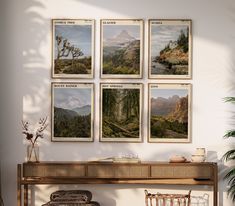 there are four pictures hanging on the wall next to a table with two chairs and a potted plant