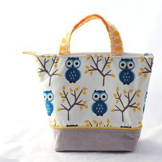 an advertisement for the zippered bag is shown in blue and white with owls on it