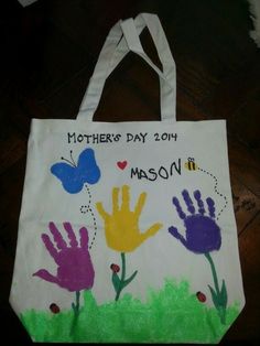 a white bag with handprints on it that says, mother's day 2014 mason