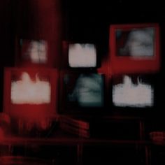 several televisions are shown in red and black