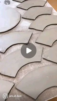 the video is showing how to make an art project with concrete blocks and cement circles