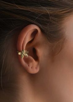 This 8.6.4. ear cuff is made from brass with a hammered design for an organic feel and is adjustable by gently squeezing to fit around the ear.    sold individually    1/2" (1.3cm) (w) 1/2" (1.3cm) (h)    made in nyc Adjustable Brass Pierced Ear Cuff, Adjustable Brass Single Ear Cuff, The Ear, Designing Women, Ear Cuff, Cuff Bracelets, Bangle Bracelets, Bangles, Cuff