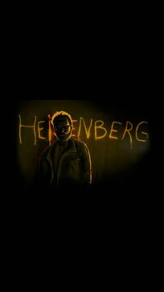 a man standing in front of a wall with the word heineenbergs written on it