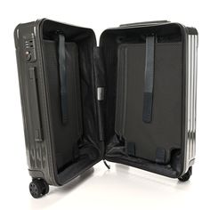 This is an authentic RIMOWA Gloss Polycarbonate Essential Cabin in Slate. This suitcase is crafted of high-performance polycarbonate in gray. The suitcase features a stage-free telescopic handle, multi wheel system, and TSA-Approved locks. The zipper opens to dark grey nylon interior with 2 removable inserts. Tsa Approved, High Performance, Dark Grey, Wheel, Cabin, Things To Sell, Zipper, Grey