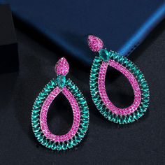 CZ Jewelry- Pera Lovely Hot Pink Red Blue Cubic Zirconia Black Gold Chic Big Long Water Drop Wedding Costume Party Earrings for Women E551Model Number:4001006418950 ◆Style: Big Long Water Drop Wedding Costume Party Earrings for Women ◆Metal Material: Copper (Lead and Nickel free) ◆Metal Color: Black Gold ◆Stone Material: Cubic Zirconia ◆Stone Color: Light Blue,Hot Pink ★Earrings Size: 4.4 cm (Remarks: Due to the manual measurement, there may be a slight error) Hot Pink Earrings, Dinner Gifts, Gold Chic, Wedding Costume, Wedding Costumes, Stone Material, Party Earrings, Long Dangle Earrings, Cz Jewelry