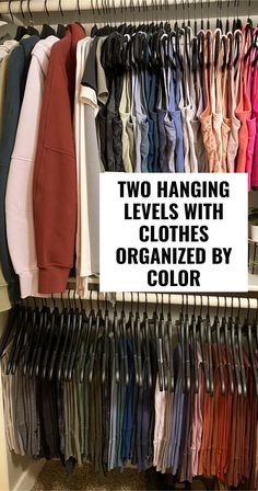 there are two hanging levels with clothes organized by color in the closet and on the shelf is a sign that says, two hanging levels with clothes organized by color