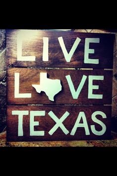 a wooden sign that says live love texas