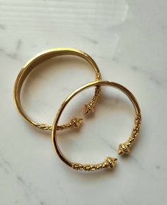 One of our favorite new designs! Unleash your inner goddess with our "Rich Goddess" Bangle Set. Bohemian and Rich vibes in one.  Available in a single or a SET OF TWO now.  Made with high-quality, 18K stainless steel and gold plating, these heavy rich girl bangles exude a regal air without fading or tarnishing. They are adjustable as well.  Plus, they make a satisfyingly "rich goddess" sound when they click together. Please sure to select the correct quantity option. 🌙Some Moon Goddess items ar Luxury Spiritual Bangle, Luxury Spiritual Bangle As A Gift, Luxury Traditional Bangle For Rituals, Luxury Spiritual Bangle For Weddings, Rich Vibes, African Bangles, Natural Cleaners, Inner Goddess, African Jewelry