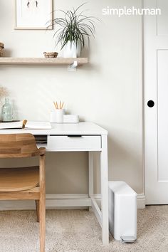 a white desk and chair in a room