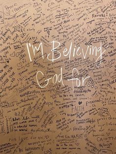 a wall with writing on it that says i'm believing god for