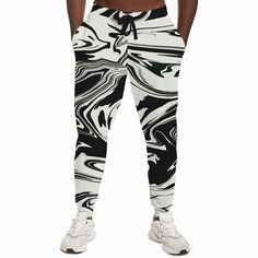 This Wavy Black & White Abstract Psychedelic Pattern Fashion Jogger is perfect for those who like to stand out. The stylish pattern will have you looking great while the durable fabric ensures long-lasting comfort. The fleece lining adds an extra layer of softness, allowing you to move and stretch with ease. Each panel is individually printed, cut and sewn to ensure a flawless graphic with no imperfections. • 20% cotton, 75% polyester, 5% spandex • Soft cotton handfeel fabric surface • Brushed f