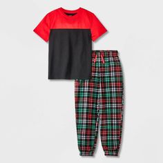 They'll love slipping off to dreamland in comfortable style in this 2-Piece Short-Sleeve Pajama Set from Cat & Jack™ . This pajama set includes a short-sleeve crewneck pajama shirt featuring a colorblock design and plaid pull-on pajama pants, both crafted from 100% recycled polyester fabric for all-night comfort. Best of all, the pajama pants are designed with a flexible drawstring for a secure and customizable fit. Cat & Jack™: Designed for all children so you can trust it's made for yours. Cute Christmas Pajamas For Boys, Boy Pajamas Adult, Christmas Pajamas Boys, Plaid Pajamas Red, Plaid Pajamas Boys, Pajama Pant, Comfortable Style, Recycled Polyester Fabric, Kids Clothes Boys