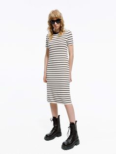 MO&Co. Women's Round Neck Striped Dress Crafted with a blend of wool and fabric, this mid-length T-shirt dress boasts a modern silhouette and stylish striped design. Perfectly pair with short boots for a minimalist, fashion-forward look. Features : - Midi T-shirt dress silhouette- Classic black and white stripes- Round neck, short sleeves Code: MBD1DRS038The back length of size S is 104cmMATERIALS & CARE Material: 67.7% Wool 32.3% PolyesterWrap metal parts before dry cleaning.REMINDER: All items Casual Striped Midi Dress For Fall, Casual Striped Knee-length Midi Dress, Spring Striped Bodycon Midi Dress, Striped Midi Dress For Work, Striped Knee-length Midi Dress For Work, Chic Striped Ribbed Midi Dress, Chic Ribbed Striped Midi Dress, Spring Workwear Dresses With Contrast Stripes, Chic Striped Short Sleeve Midi Dress