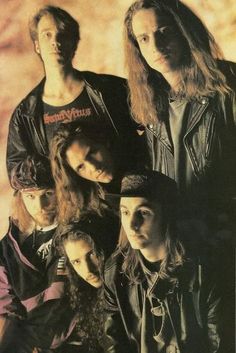 the band aeroplanes posing for a photo in their black leather jackets and hats