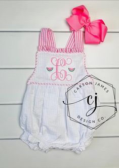 Check out this precious watermelon sunsuit! Perfect for those hot summer days!The Sunsuit is white seersucker with pink seersucker trim. The shoulder straps tie in the back making it adjustable for the perfect fit. Snaps line the bottom for easy diaper changes!A large single initial with a mini watermelon on either side is embroidered directly onto the romper using thread. Fits true to size, please refer to the size chart for sizing questions.Hair bow is not included but is for sale separately i Fitted Bubble Romper For Summer Vacation, White Fitted Bubble Romper For Summer, Fitted Summer Vacation Bubble Romper, White Summer Bubble Romper For Beach, Pink Summer Bubble Romper For Vacation, Summer Vacation Fitted Bubble Romper, Fitted White Bubble Romper For Beach, Pink Summer Bubble Romper For The Beach, Pink Fitted Bubble Romper For The Beach