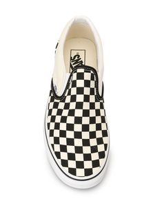 White and black checked Slip-on sneakers from Vans featuring a round toe, a branded insole and a white rubber sole. | Vans checked Slip-on sneakers Vans Slip-on Sneakers With Round Toe, Vans Slip-on Sneakers With White Sole, Vans Slip-ons With Round Toe And White Sole, Vans Slip-on Sneakers With Rubber Sole, Vans Checkerboard Slip On, Slipon Sneakers, Vans Shop, Vans Classic Slip On Sneaker, Slip On Sneakers