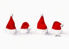 three red and white santa hats sitting on top of each other in front of a white background