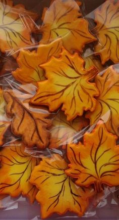 orange and yellow leaf shaped cookies in plastic wrappers