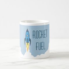 a blue rocket fuel mug with the words rocket fuel on it