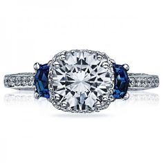 a diamond and blue sapphire engagement ring