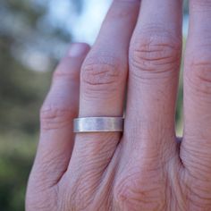 This ring has a light texture for those who don't care for shiny silver. It has a lovely soft glow instead. This would make a great wedding band. Made of sterling silver. Measurements: The band is 3/16" wide. Fits size 5.5. The band is about 1mm thick. Ring comes in a hand-sewn drawstring gift bag made out of repurposed fabrics or an eco-friendly gift box. Silver Ring Band, Drawstring Gift Bag, Thick Ring, Silver Band Ring, Eco Friendly Gifts, Light Texture, Shiny Silver, Ring Band, Hand Sewn