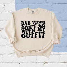 Keep your vibes in check with this sweatshirt for our ladies! Bad vibes do not have a place in your outfit!  This is a wonderful gift for her or for yourself! This is a unisex Gildan heavy blend sweatshirt, which is a combination of 50% cotton and 50% polyester which is incredibly soft and durable. The sweatshirts are unisex sizing and the fleece will keep you warm this winter! Colors available for this sweatshirt are: Purple, Orange, Sand, Black, Heather Dark Sport Green Depending on the color chosen, vinyl/design color may vary so it is more visible on the shirt. For example, a black shirt may have white vinyl while a white shirt may have black vinyl. If you have a preference on design color, please tell us in the personalization box! Design colors available are white or black! All items Relaxed Fit Sweatshirt With Funny Print For Loungewear, Fall Sweatshirt With Funny Print And Relaxed Fit, Trendy Comfortable Fit Sweatshirt With Letter Print, Trendy Comfortable Letter Print Sweatshirt, Trendy Relaxed Fit Sweatshirt With Lettering, Trendy Funny Print Sweatshirt For Loungewear, Trendy Comfortable Sweatshirt With Graphic Print, Trendy Comfortable Fit Sweatshirt With Graphic Print, Trendy Relaxed Fit Sweatshirt With Funny Print