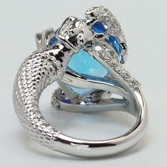 a silver ring with blue and white stones