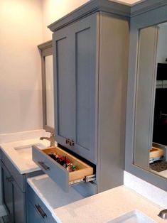 a bathroom sink with an open drawer in it