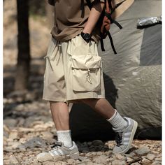 Summer Casual Elastic Waist Cargo Shorts Fabric: 100%polyester Size: M, L, XL, 2XL, 3XL Multiple Color Selections: Black, Khaki, Coffee  Season: Summer Techwear Cargo Shorts With Pockets For Hiking, Techwear Hiking Cargo Shorts With Side Pockets, Hiking Techwear Shorts With Multiple Pockets, Short Cargo Shorts With Pockets For Camping, Cargo Shorts With Pockets For Camping, Baggy Casual Shorts For Outdoor, Casual Baggy Shorts For Outdoor, Urban Style Summer Outdoor Bottoms, Casual Camping Bottoms With Multiple Pockets