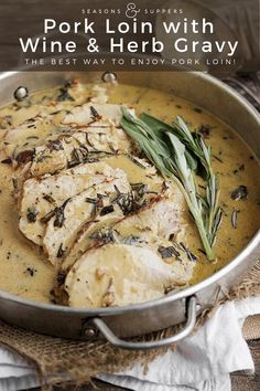 pork loin with wine and herb gravy in a pan on a table