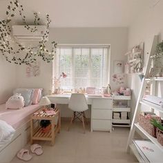 a bedroom with white furniture and lots of pink decorations on the walls, along with shelves