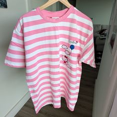 Discontinued Sanrio Hello Kitty X Hypland Collab Oversized Embroidered Striped Tee. New Without Tags. Non-Smoking Home. There Is A Small Grey Marking On The Front As Pictured That Looks Like Pencil; It Came Like This When I Received It From Hypland. Looks Very Light And Will Probably Wash Off. Cute Oversized Pink Top, Cute Oversized White T-shirt, Oversized Pink Top With Cartoon Print, Shirts Hello Kitty, Embroidered Tee, Striped Tee, Pink White, Hello Kitty, Tee Shirts