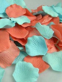 some pink and blue flowers on a white table