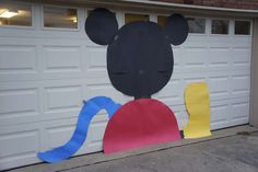 a garage door decorated to look like mickey mouse