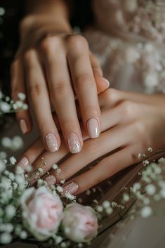 a woman's hands with french manies and flowers