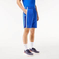 These diamond taffeta shorts from Lacoste, sporting experts since 1933, are designed to offer full freedom of movement match after match. Made from lightweight fabric with a loose cut for maximum comfort. The colorful side stripes create a modern feel, while the jersey lining is there to keep you covered. Short Sports Bottoms With Contrast Stripes, Sportswear Shorts With Side Stripes For Sports, Sports Athletic Shorts With Side Stripes, Athletic Shorts With Side Stripes For Sports, Short Athletic Shorts With Side Stripes For Sports, Sporty Tennis Shorts With Elastic Waistband, Sportswear Athletic Shorts With Side Stripes, Sporty Shorts With Side Stripes For Sports, Sporty Athletic Shorts For Tennis