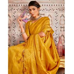 Mustard colored saree is prettified with beautiful weaving work as shown which makes it appear classy. This saree is made of art silk fabric which is accompanied with art silk blouse piece which you can customise as per your design/style. Women can buy this saree to wear for their party, festive, sangeet functions and homely events and ideal for any fashionista. Note:- The actual product may differ slightly in color and design from the one illustrated in the images when compared with computer or mobile screen. Slub Silk Saree With Zari Work, Unstitched Slub Silk Saree, Festive Raw Silk Saree With Unstitched Blouse, Gold Slub Silk Traditional Wear With Unstitched Blouse, Unstitched Bollywood Slub Silk Saree, Festive Pre-draped Saree With Zari Weaving In Slub Silk, Gold Anarkali Blouse Piece In Slub Silk, Unstitched Slub Silk Saree For Eid, Elegant Yellow Tussar Silk Lehenga