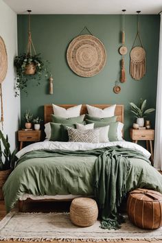 a bed with green sheets and pillows in front of a wall with hanging plants on it