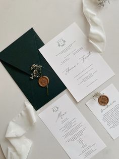 the wedding stationery is laid out on the table