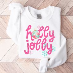 Holly Jolly Sweatshirt Find size guide and sweater colors in the photos  unisex fit please choose size in the drop down box Holiday White Graphic Print Sweatshirt, Holiday Graphic Print White Sweatshirt, Christmas Merch, Sweater Colors, Holly Jolly Christmas, Womens Sweatshirts, Jolly Christmas, Holiday Sweater, Holly Jolly